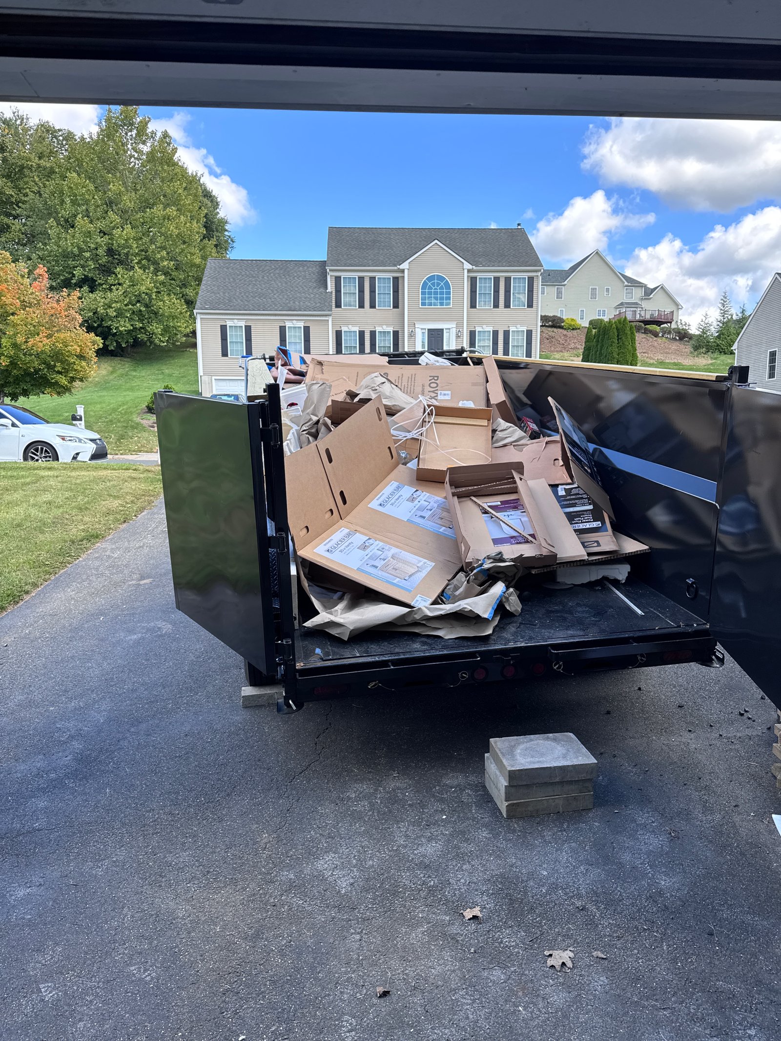 Loaded dump trailer during a residential cleanout job